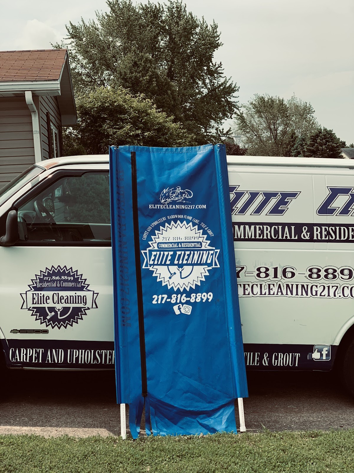Elite Cleaning van with its branded banner